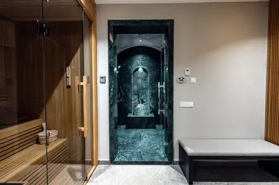 a glass door to a shower in a room at Villa l'Hermitage in Oulad Mbark