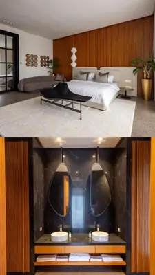 a bedroom with a large bed and a table at Villa l'Hermitage in Oulad Mbark