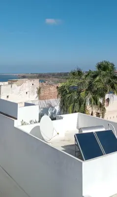 a view of the beach from the roof of a house at Dar DIESUS NOOR in Azemmour