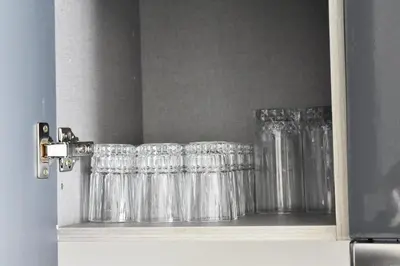 a row of glasses sitting on a shelf at Myhiven Immob in Casablanca