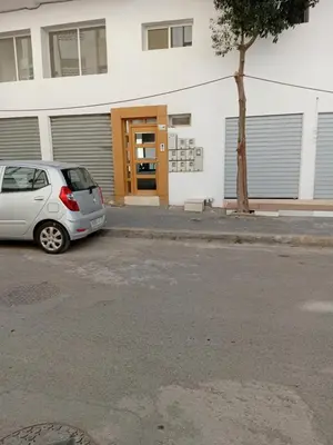 a small silver car parked in front of a building at Appartement Jad & Rim in Bouznika