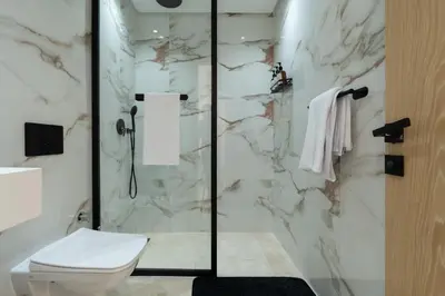a bathroom with a toilet and a shower at Modern & bright studio Balcony & Parking Maarif in Casablanca