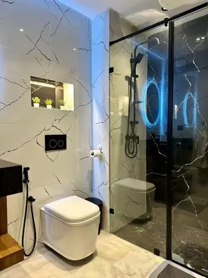 a bathroom with a toilet and a shower at Maarif in Casablanca