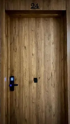 a wooden door with the number on it at Maarif in Casablanca