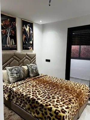 a bedroom with a leopard print bed in a room at Skyline Urban - by Nero in Casablanca