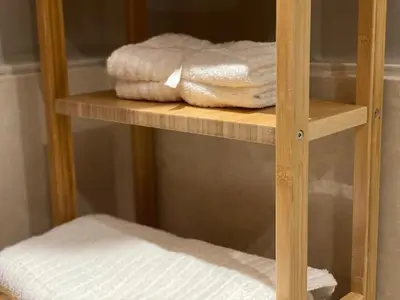a wooden shelf with some towels on it at Welcome to Casablanca in Casablanca