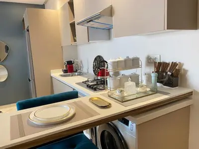 a kitchen with a counter with a washing machine at Welcome to Casablanca in Casablanca