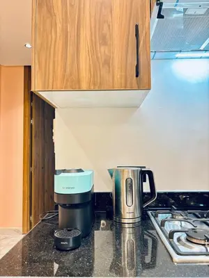 a coffee maker on a counter in a kitchen at Luxury 1-Bedroom Apartment in Maarif in Casablanca