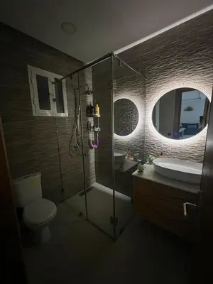 a bathroom with a shower and a toilet and a sink at Dar al bahr in Rabat