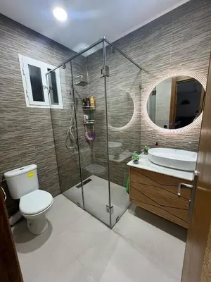 a bathroom with a shower and a toilet and a sink at Dar al bahr in Rabat