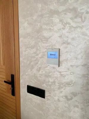 a door with a control sign on a wall at Appartement in Casablanca