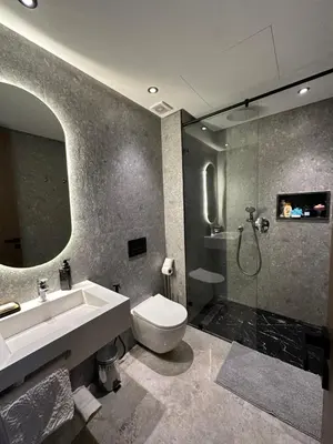 a bathroom with a sink and a toilet and a shower at Deux studios luxueux à palmiers Casablanca in Casablanca
