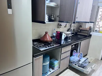 a kitchen with a stove and a tea kettle on it at Beachfront apartment in Rabat