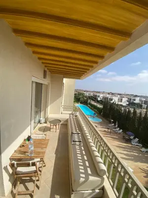 a balcony with a view of a swimming pool at Dar Bouazza piscine Bab Rayan in Casablanca