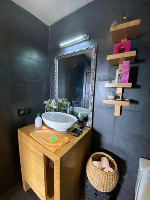 a bathroom with a sink and a mirror at Dar Bouazza piscine Bab Rayan in Casablanca