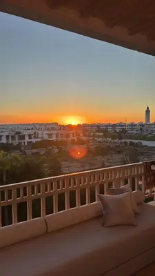 a view of a sunset from a balcony at Dar Bouazza piscine Bab Rayan in Casablanca