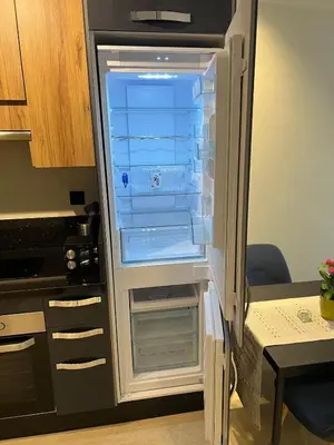 an empty refrigerator with its door open in a kitchen at Great for families and couples in Casablanca