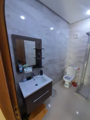 a bathroom with a sink and a toilet at Le passage inoubliable in Bouznika