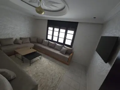 a living room with a couch and a table at Faridi house in Casablanca