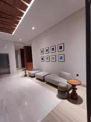 a living room with a couch and a table at Panoramic ocean view appartement in Casablanca