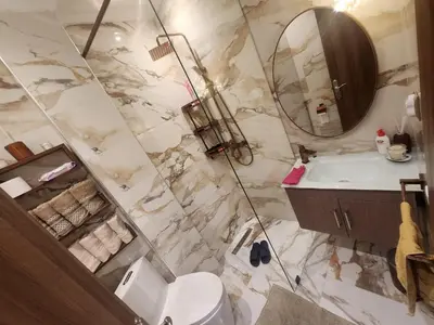 a bathroom with a sink and a mirror at Kawtar in Mansouria
