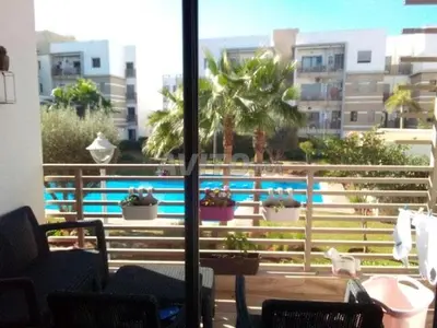 a view of a swimming pool from a balcony at Résidence fal green bouskoura in Bouskoura