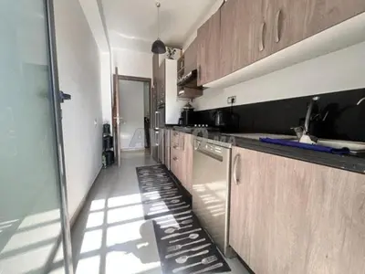 a kitchen with a sink and a dishwasher at Résidence fal green bouskoura in Bouskoura