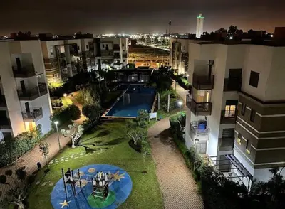 an aerial view of a apartment complex at night at Résidence fal green bouskoura in Bouskoura