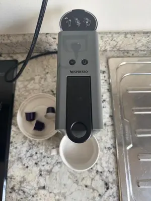 a black and white speaker on a counter at Appartement au parc à 3 minutes de la plage in Mohammedia