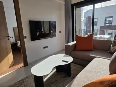 a living room with a couch and a table at Résidence EDEN 4 - Casablanca Center in Casablanca