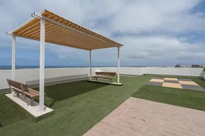 a pavilion on top of a roof with a bench at Studio Raffiné et Lumineux in Casablanca