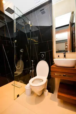 a bathroom with a toilet and a sink and a shower at Atelier Aedes - Studio 2 in Maarif