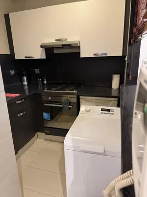 a small kitchen with a stove and a dishwasher at Nice Studio rabat in Rabat