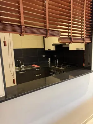 a kitchen with wooden blinds and a kitchen counter at Nice Studio rabat in Rabat