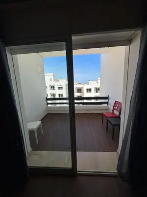 a view of a balcony from a room with a window at Apartment with pool view, 1 min to beach, private parking in Pont Blondin
