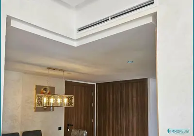a room with a ceiling with a chandelier at Escapade océane à El Mansouria in Mansouria