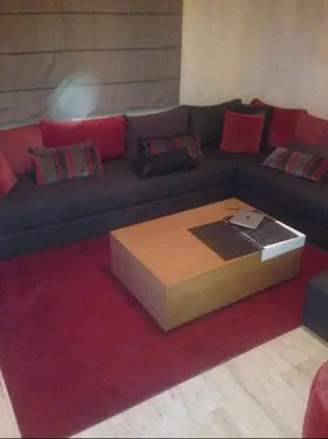 a living room with a couch with a coffee table at Home Stay Casa in Casablanca