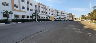 an empty street in front of a large building at Appartement situated 10 min from city center in Settat