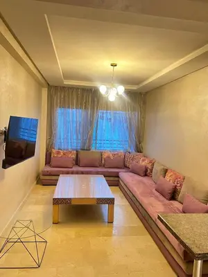 a living room with a couch and a table at Flora Nora - Central Tramway - by Mi-haven in Casablanca