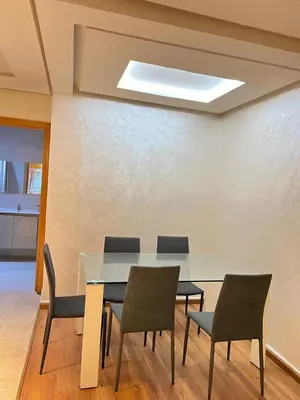 a dining room with a table and four chairs at Flora Nora - Central Tramway - by Mi-haven in Casablanca