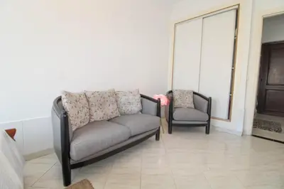 a living room with two chairs and a couch at Studio Panoramique, Mosquée Hassan II, Cœur de la Médina in Casablanca