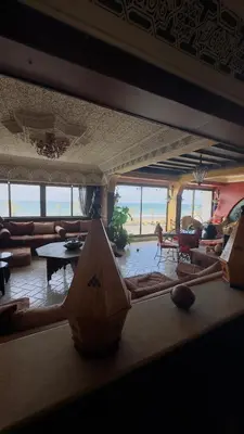 a living room with a couch and a table at Zaouia in Rabat