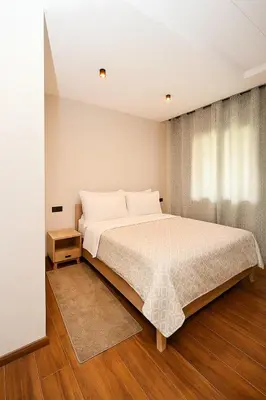 a bedroom with a large bed and a window at Atelier Aedes - Studio 1 in Maarif