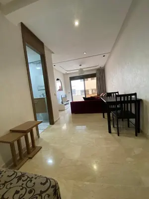 a living room with a table and a couch at 1 bed with balcony near CFC in Casablanca