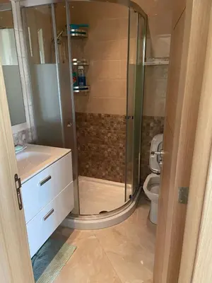 a bathroom with a shower and a toilet at Casabay SidiRahal Appartement à louer in Sidi Rahal