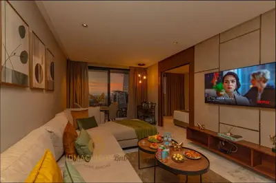 a living room with a couch and a tv at Butterfly 703 Harve de paix au Cœur de Casablanca in Casablanca