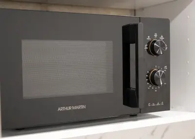 a microwave oven sitting on top of a shelf at Appartement Cosy Casablanca in Casablanca