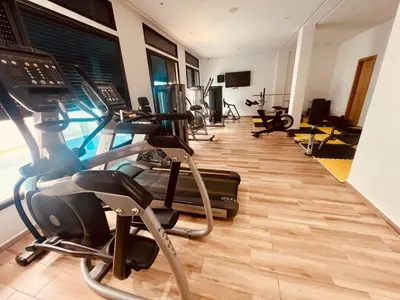 a gym with treadmills and elliptical machines at W&M LUXOR residence TEMARA in Temara