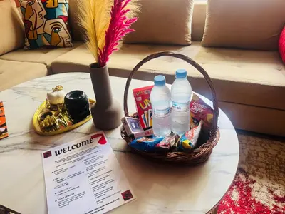 a table with a basket of snacks and water bottles at Le belvédère in Casablanca