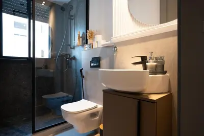 a bathroom with a sink and a toilet and a shower at Central Cozy & Great Location with 2 Balconies Fast Wifi 2 Minutes to KFC Mcdo Bd 2 Mars in Casablanca